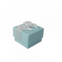 Emballage bleu en carton avec noeud pour le plaisir d'offrir